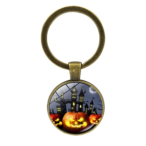 Vintage bronze Halloween keychain featuring spooky pumpkin and castle glass pendant