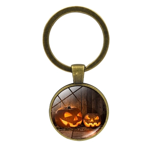 Vintage bronze Halloween keychain featuring Jack-O-Lantern pumpkin glass dome design