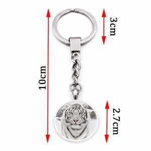 White tiger glass cabochon keychain in silver metal with size dimension labels