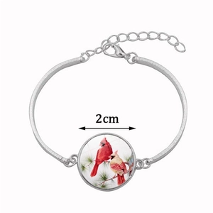 Bracelet argent avec pendentif 2cm en verre illustrant des cardinaux sur une branche