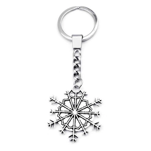 Silver metal snowflake keychain with geometric pendant on a clean white background