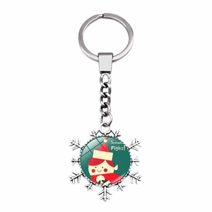 Detail of snowflake metal keychain with cute elf glass dome and Snowball Fight text