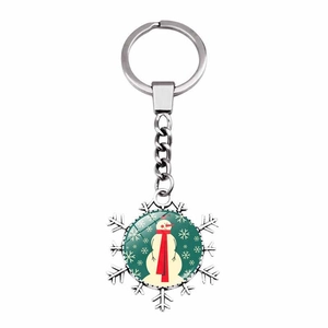 Detail of snowflake metal keychain featuring a cute snowman charm with red scarf