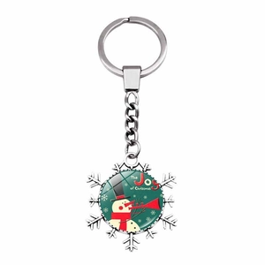 Snowflake metal keychain with Christmas snowman charm and The Joy of Christmas text