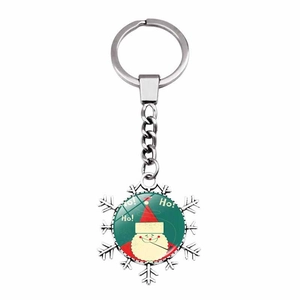 Close-up of snowflake keychain with Santa Claus glass gem and Ho Ho Ho text detail