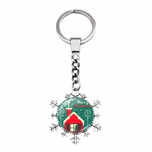 Detailed view of silver snowflake keychain with Merry Christmas house graphic pendant