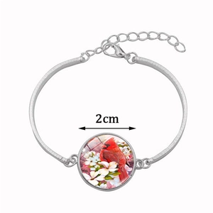 Silver half moon bracelet with 2cm red cardinal glass pendant and floral motif
