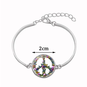 Silver crescent moon bracelet with colorful butterfly peace sign glass dome pendant