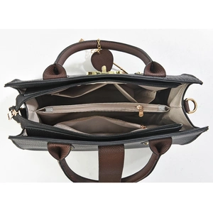 Detailed top view of the interior compartments and lychee texture of the women handbag