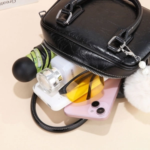Black bowling bag interior showing large capacity for umbrella, phone and essentials