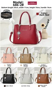 Detailed view of women's lychee grain leather tote bag showing internal zipper compartments