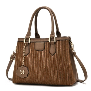 Brown leather handbag with textured V-shape woven design and adjustable shoulder strap