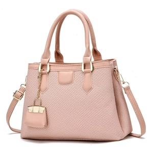Fashionable pink macabre handbag with woven texture and adjustable shoulder strap