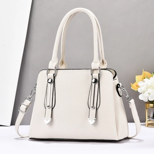 Elegant off-white lychee leather tote bag with dual handles and silver hardware accents