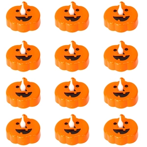 Set of 12 orange LED pumpkin candles with hollowed-out faces for Halloween party decor