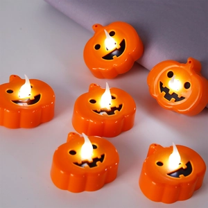 Detail showing set of six glowing Halloween LED pumpkin candle lights for party decor