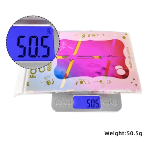 Detail showing the 50.5g weight of packaged diamond rain tinsel curtain for party decor