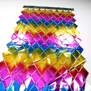 Close-up of rainbow gradient diamond mesh foil curtain with metallic shine for party decor