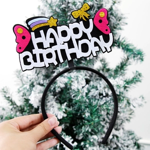 Detail of Happy Birthday headband with pink glitter wings and rainbow meteor accents