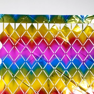 Close-up of rainbow gradient diamond grid foil fringe curtain for party background