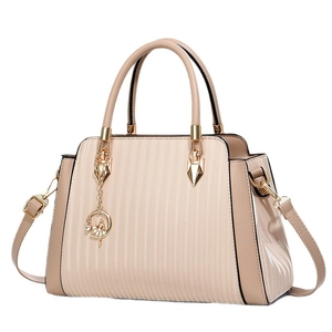 Elegant beige tote bag with striped texture, gold hardware and ballerina pendant