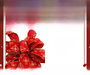 Close-up of red faux linen Christmas bow with gold glitter snowflake patterns and piping