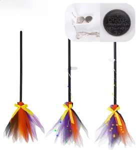 Detail of Halloween witch broom showing LED light effects and CR2032 battery power source