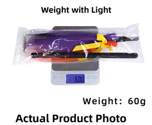 Detailed scale view of Halloween LED witch broom with purple mesh weighing 60 grams