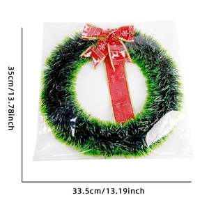 Detail showing Christmas tinsel wreath dimensions 35x33.5cm with red reindeer bow