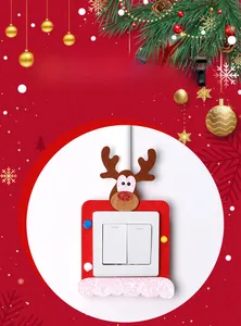 Detail view of festive red felt Christmas switch cover with reindeer and pom-poms decor