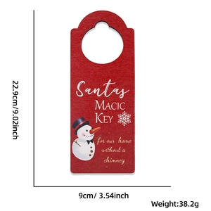 Detailed size specifications for a wooden Christmas snowman door hanger with magic key design