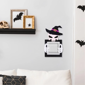 Halloween felt switch cover featuring a pink skull with wizard hat and festive wall decor