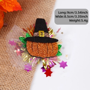 Detailed view of Halloween pumpkin and witch hat hair clip with mesh and colorful tassels