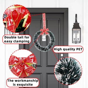 Christmas wreath with artificial green pine needles and a festive red bow for home decor