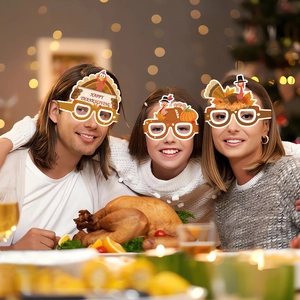 Family wearing Thanksgiving paper glasses with turkey and pumpkin designs for party