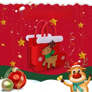 Detail of red Christmas felt gift bag featuring cartoon reindeer embroidery and handles