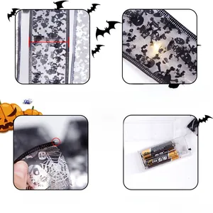 Detail of 5cm wide Halloween mesh ribbon with skull prints and battery-operated LED wire