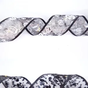 Detail of Halloween LED ribbons with silver spider webs and black skull patterns