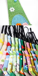 Detail of glitter Easter neckties featuring colorful rabbits and eggs with elastic straps