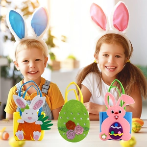 Three Easter felt gift bags with rabbit and egg patterns on a wooden tabletop setting