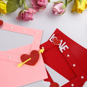 Detail of pink and red felt Valentine picture frames with LOVE text and pearls