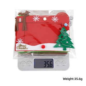 Weight measurement of a red non-woven Christmas frame with reindeer and tree motifs