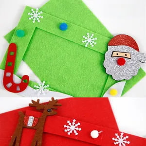 Detailed close-up of DIY Christmas non-woven photo frames with Santa and elk 3D felt icons