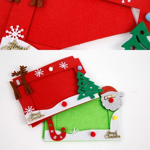 Detail of red and green Christmas felt photo frames with Merry Christmas gold lettering