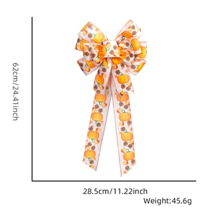 Detail view of large Thanksgiving bow showing dimensions 62x28.5cm with pumpkin and maple pattern