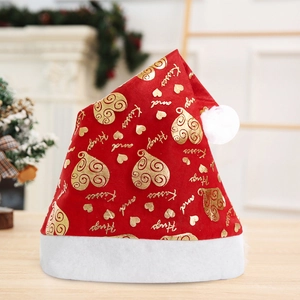 Close-up of red non-woven Christmas hat featuring gold heart patterns and festive text