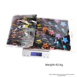 Weighing display of black star pattern fringe banners for party decoration in packaging