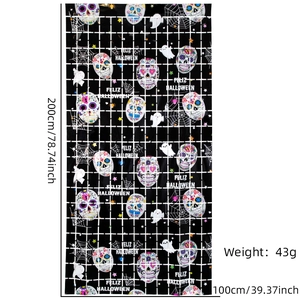 Close-up of Halloween foil curtain with colorful skulls and ghosts pattern, 200cm by 100cm