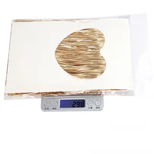 Macro shot showing 29.8g of gold metallic fringe party decor in clear polybag packaging