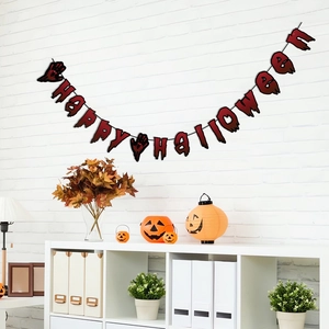 Macro view of bloody Happy Halloween banner with handprints on a white brick wall